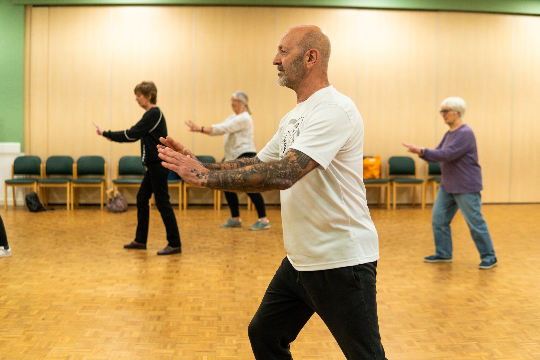 Class of people doing Tai Chi