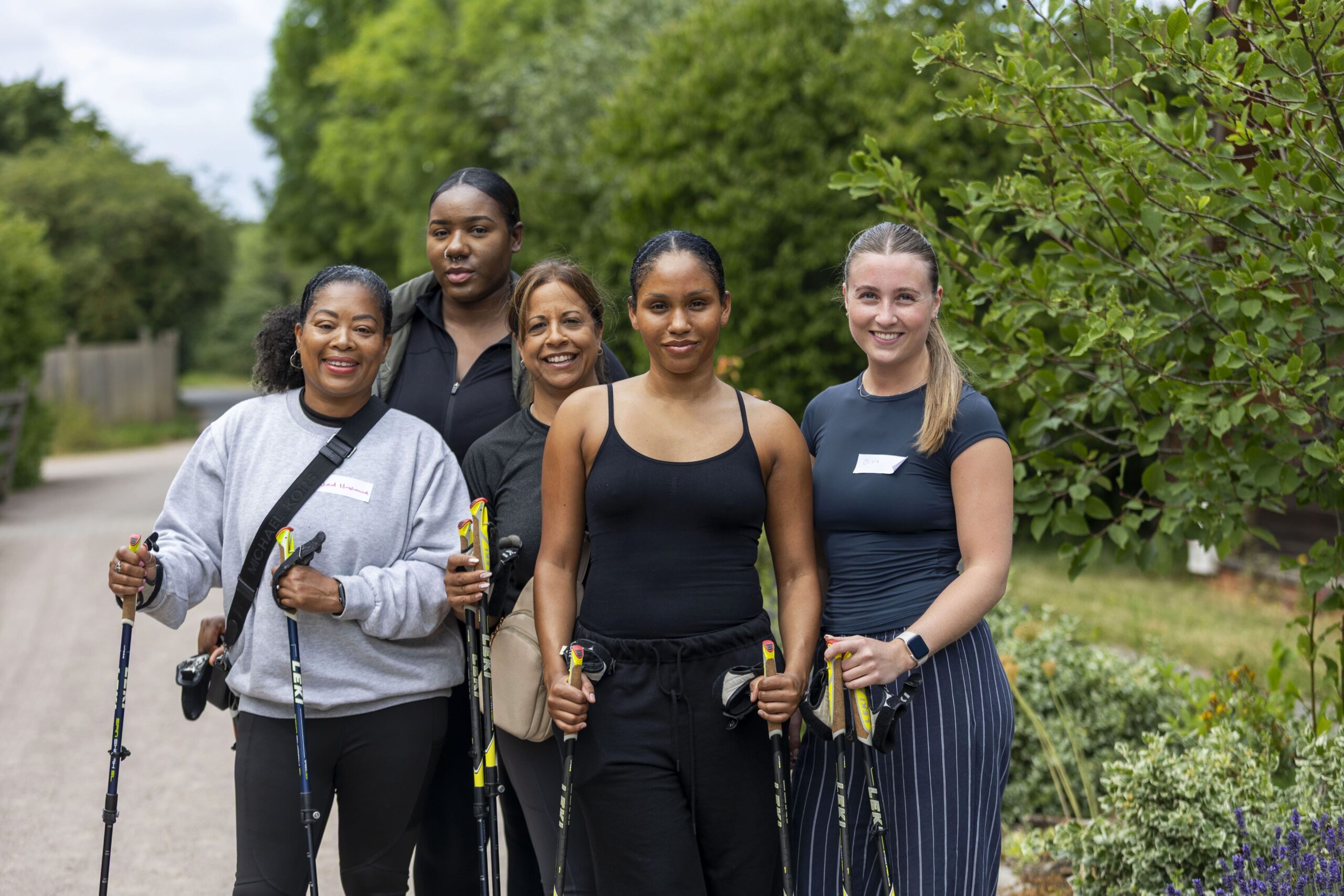 5 people with nordic walking poles