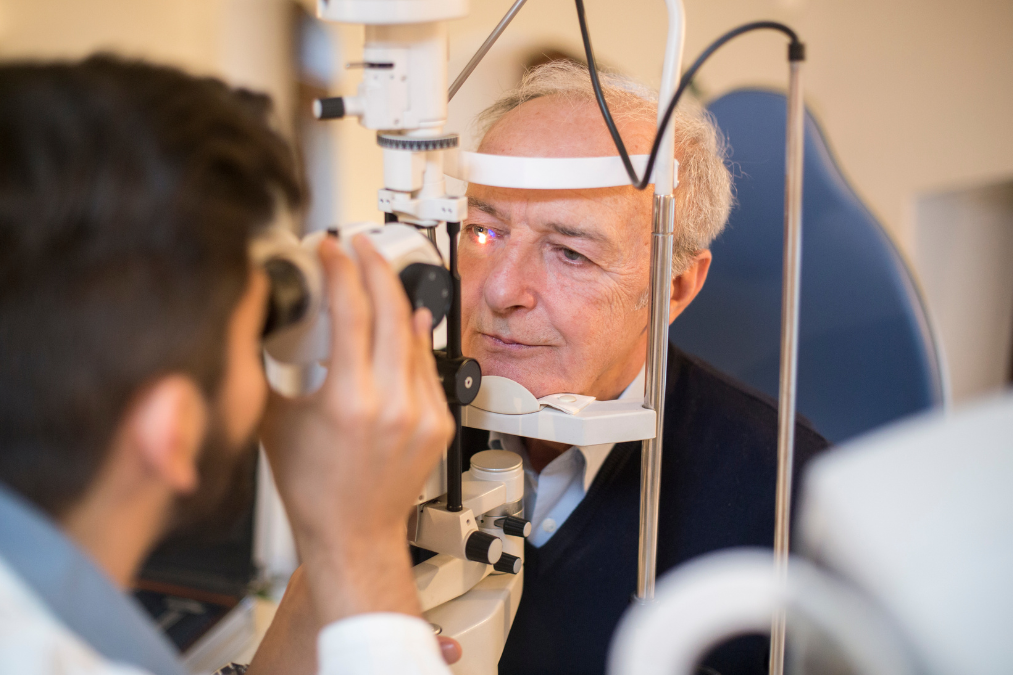 Man looking into the eyes of an optician