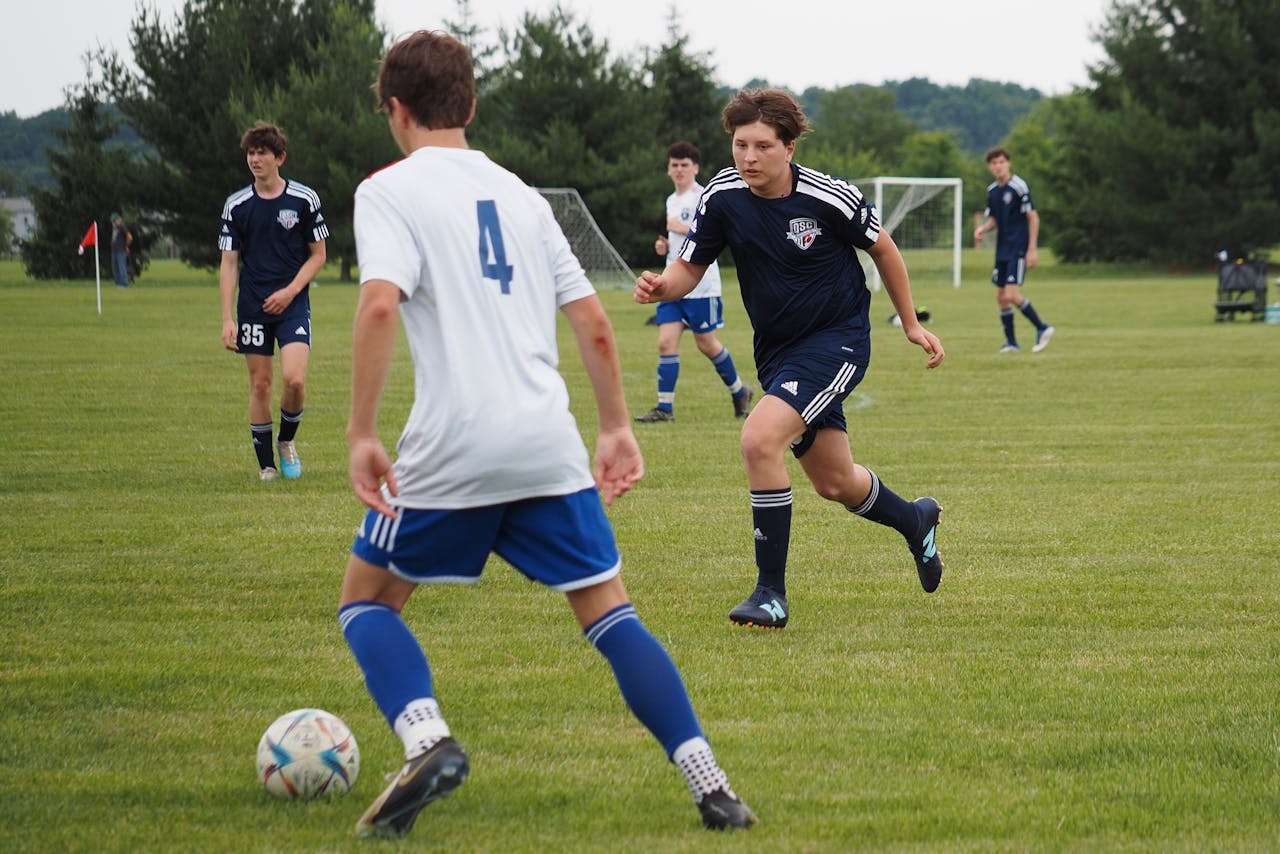 football football pitch with boys playing football