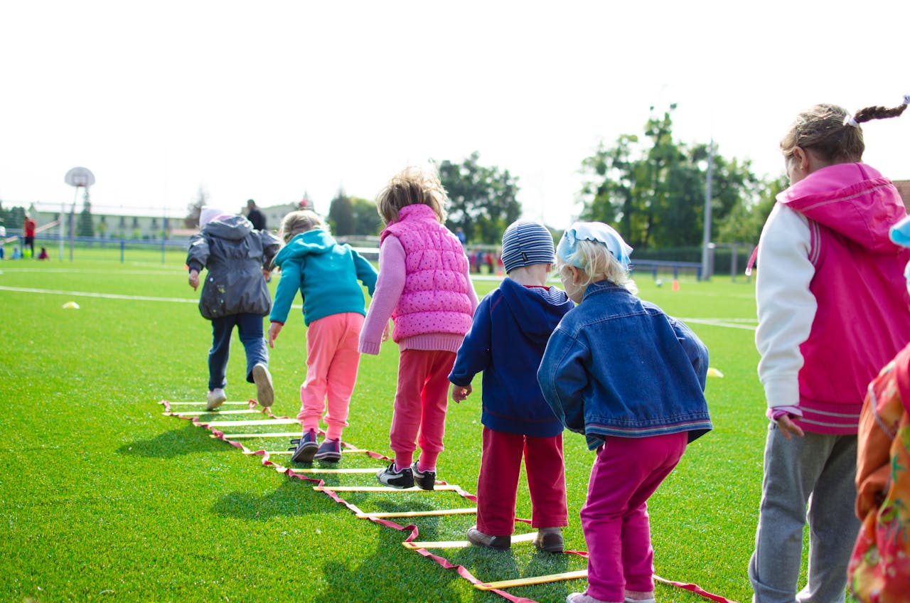 Kids playing sport together on a field