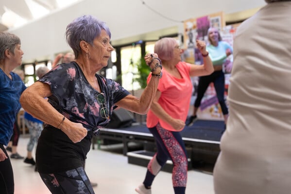 Two women dancing in a zumba class