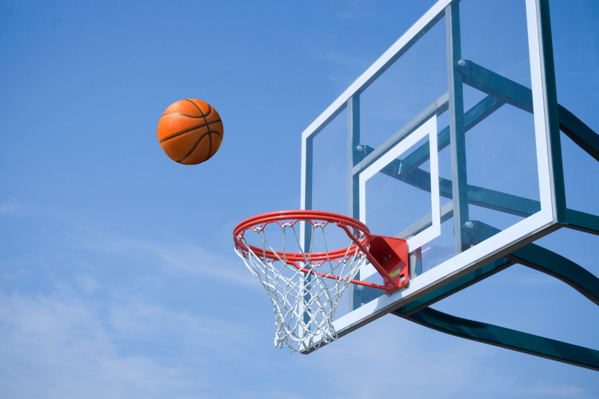 eye test (7) A basketball flying into a basketball hoop.