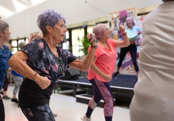 Two women dancing in a zumba class
